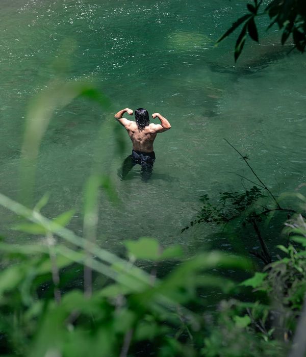 Man performing a foundational strength exercise in a calm environment.